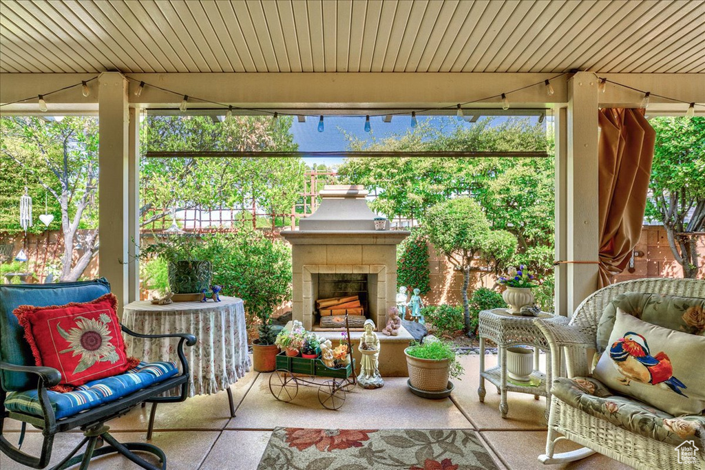 View of patio / terrace featuring a fireplace