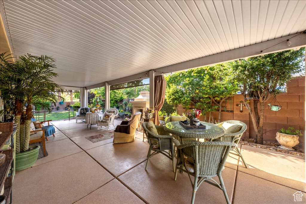 Fenced backyard with outdoor dining space and a patio area