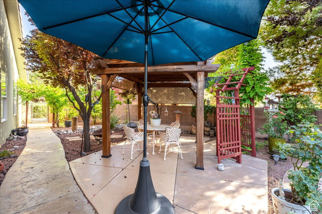 Fenced backyard featuring outdoor dining area and a patio area