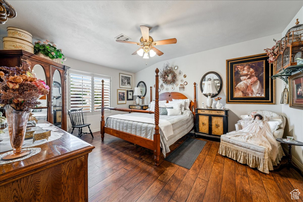 Bedroom with hardwood / wood-style flooring