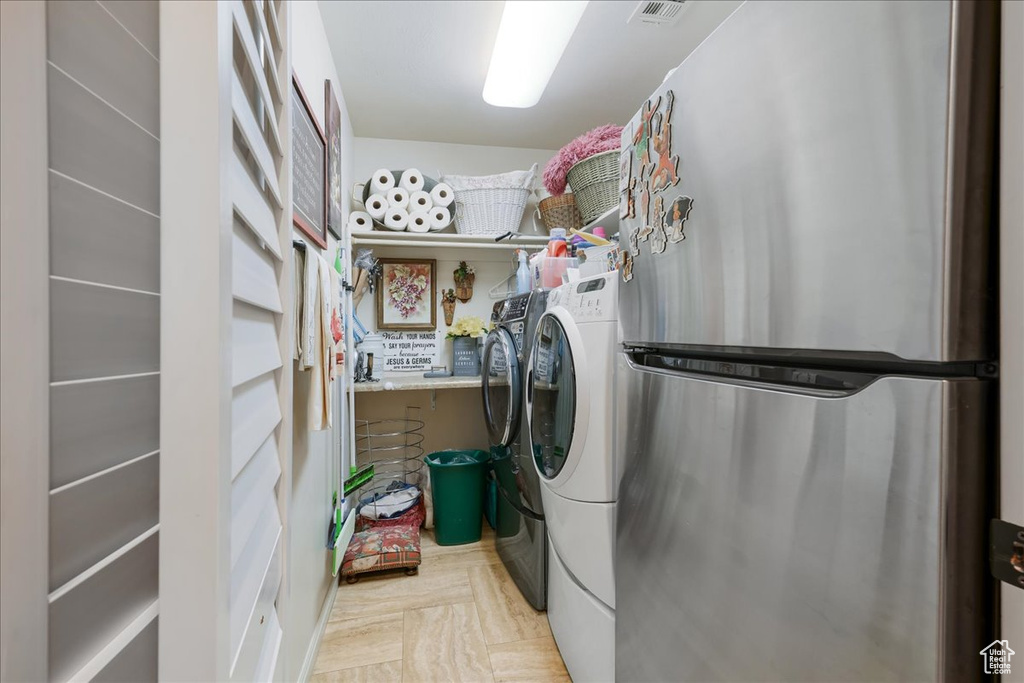 Laundry area featuring washing machine and clothes dryer