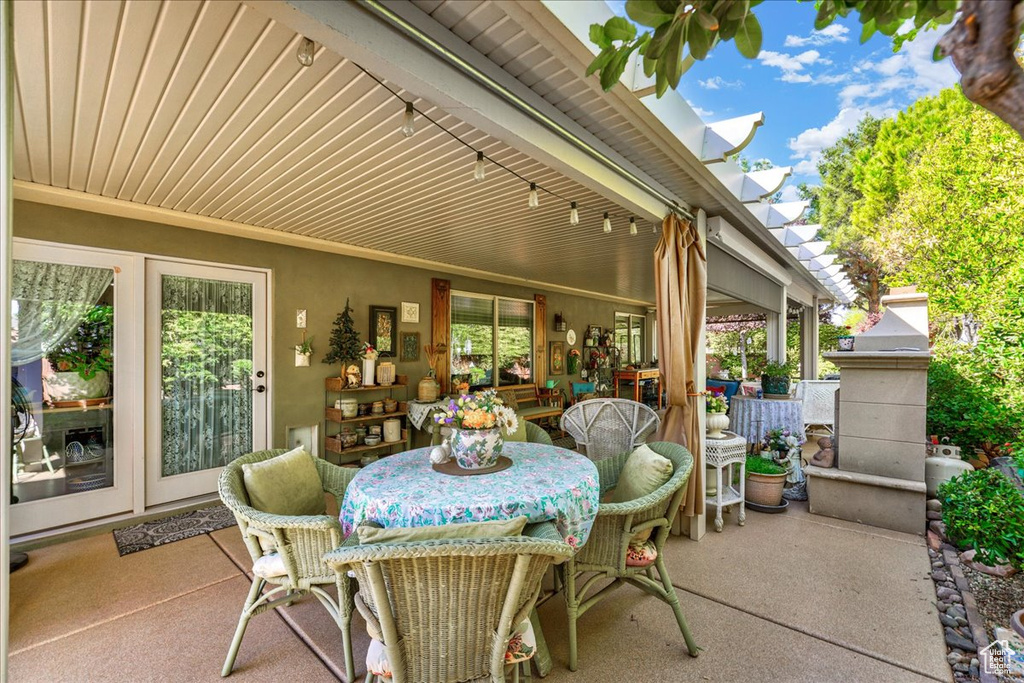 View of patio with outdoor dining area