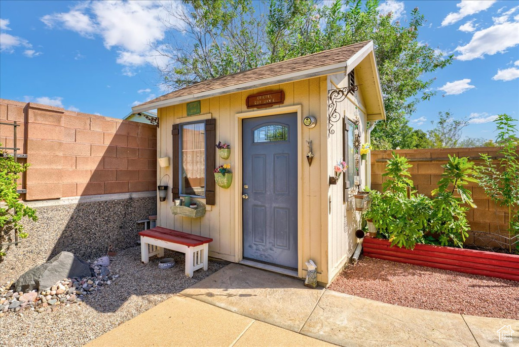 View of outdoor structure with a fenced backyard