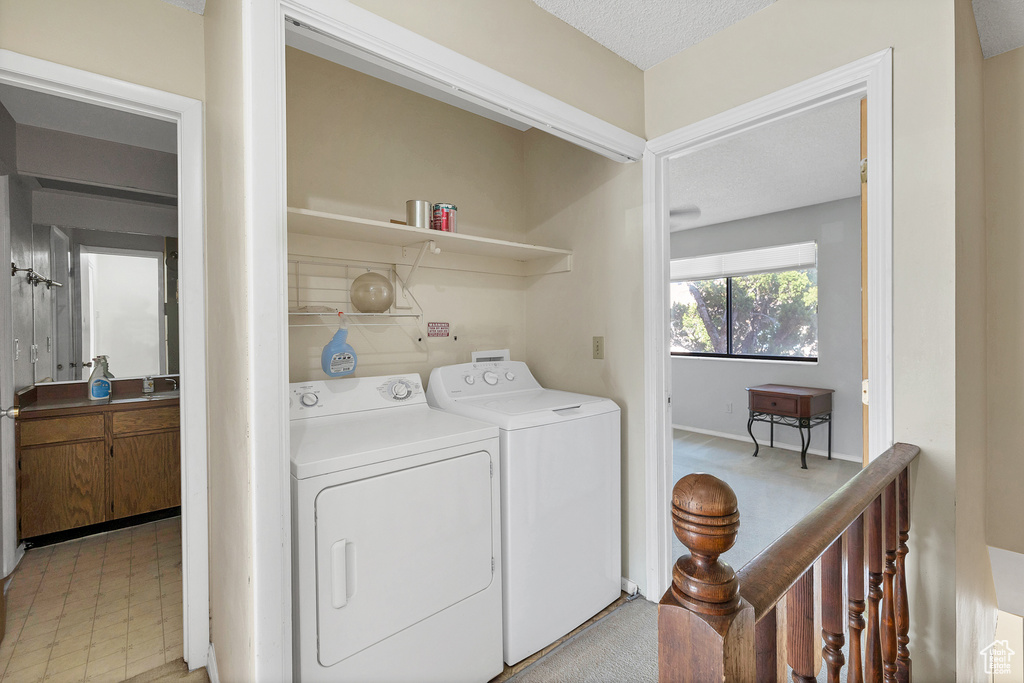 Washroom with washing machine and clothes dryer