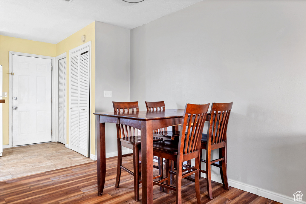 Dining room with baseboards and wood finished floors