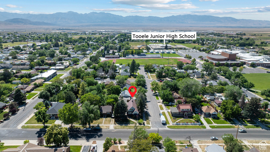 Aerial view of residential area with a mountainous background