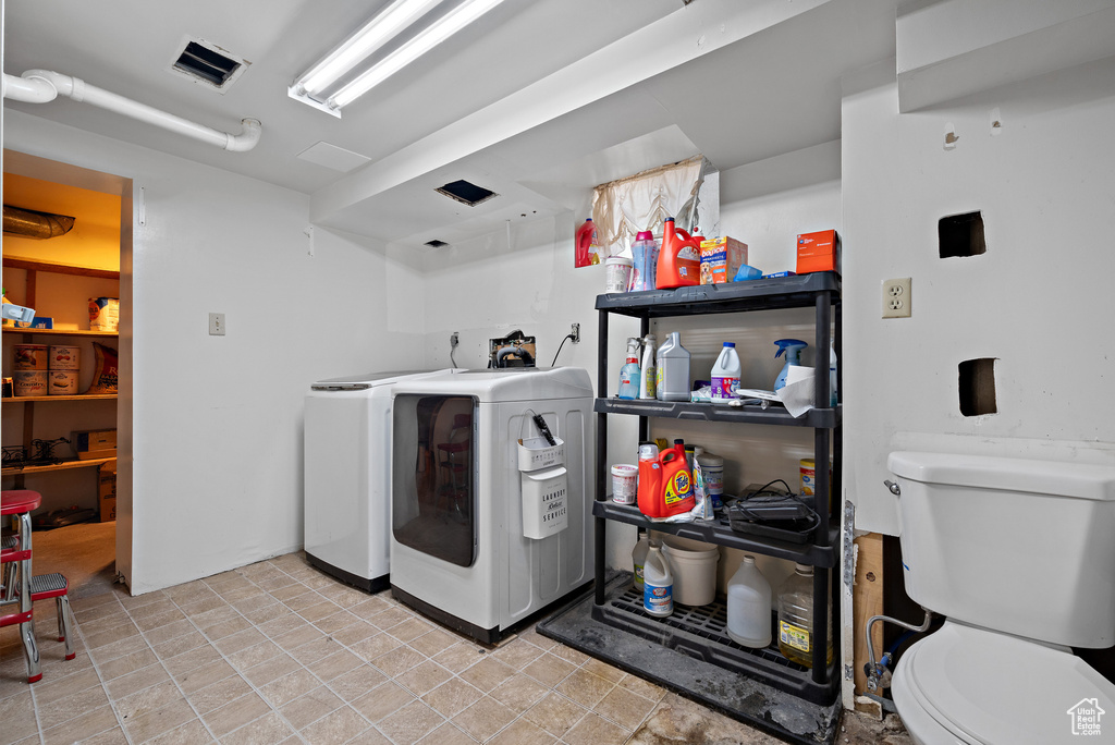 Washroom featuring washer and dryer