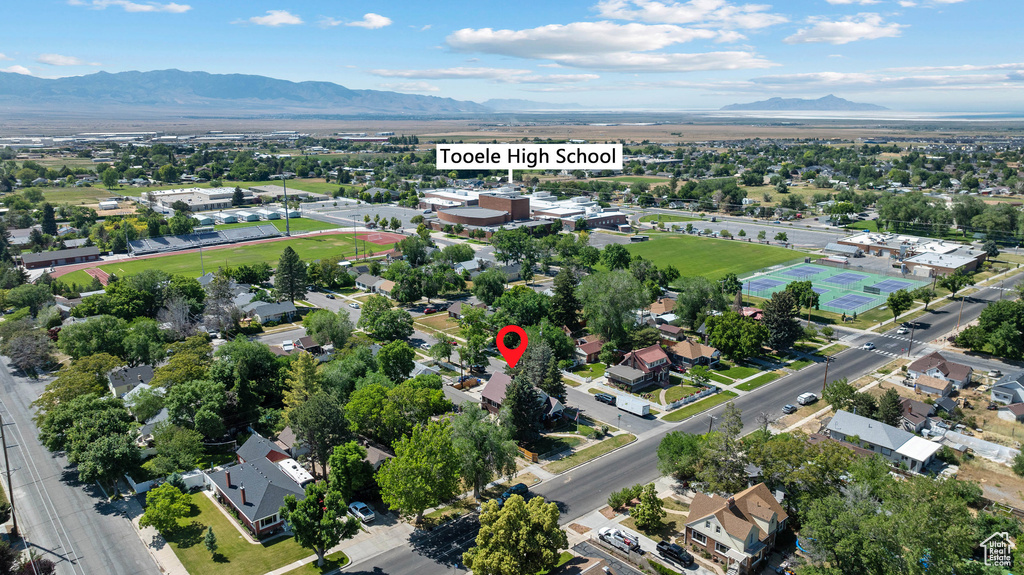 Aerial view of property's location with a mountainous background