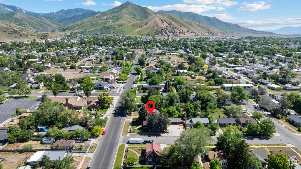 View of property location featuring a mountainous background and nearby suburban area