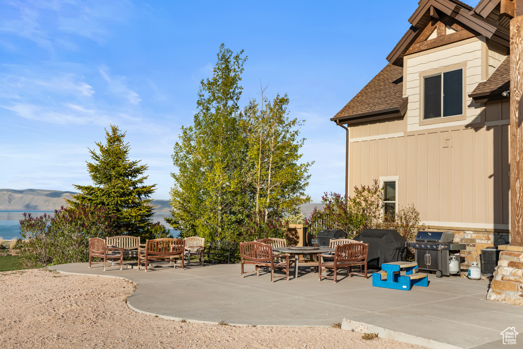 View of patio / terrace with area for grilling and a mountain view