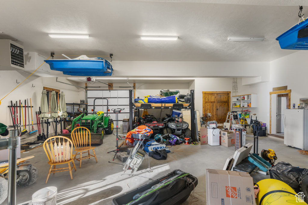 Garage with freestanding refrigerator