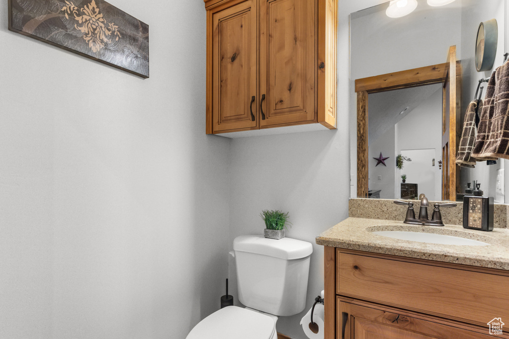 Bathroom with toilet and vanity