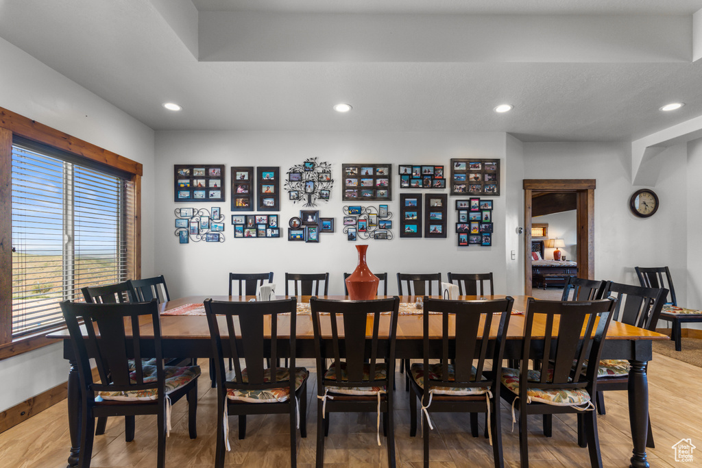 Dining room with baseboards, recessed lighting, and light wood-style flooring