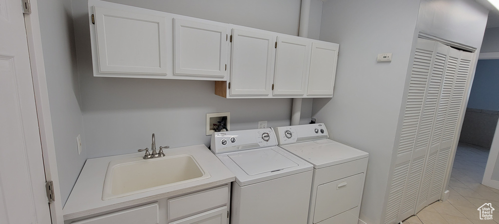Laundry room with independent washer and dryer and cabinet space