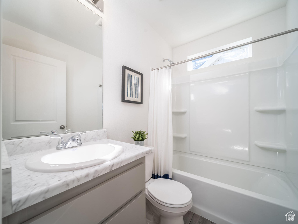 Bathroom featuring vanity and shower / tub combo