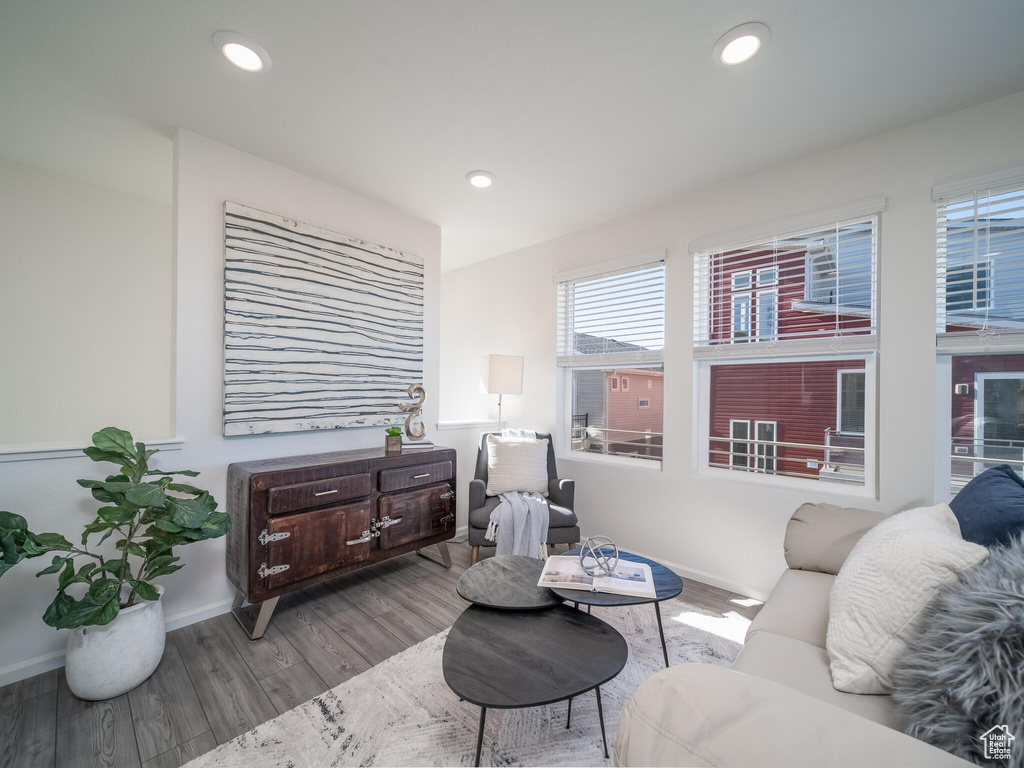 Living area featuring wood finished floors and recessed lighting