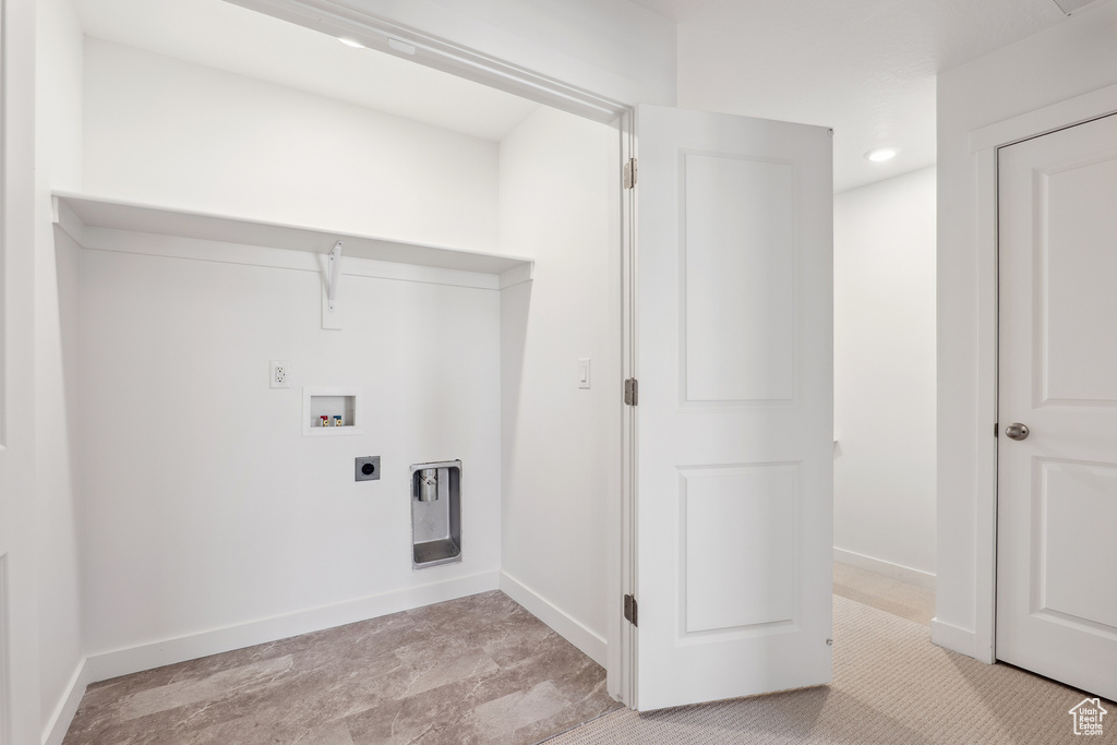 Laundry room with hookup for an electric dryer, washer hookup, baseboards, and recessed lighting