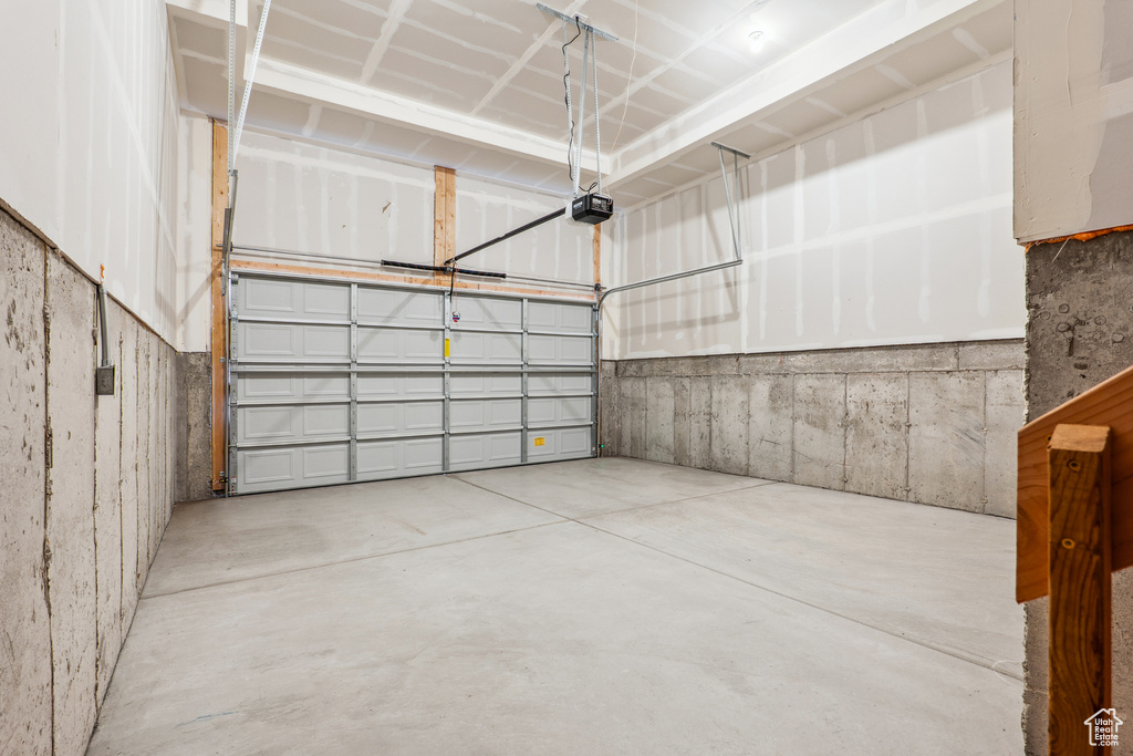 Garage featuring a garage door opener