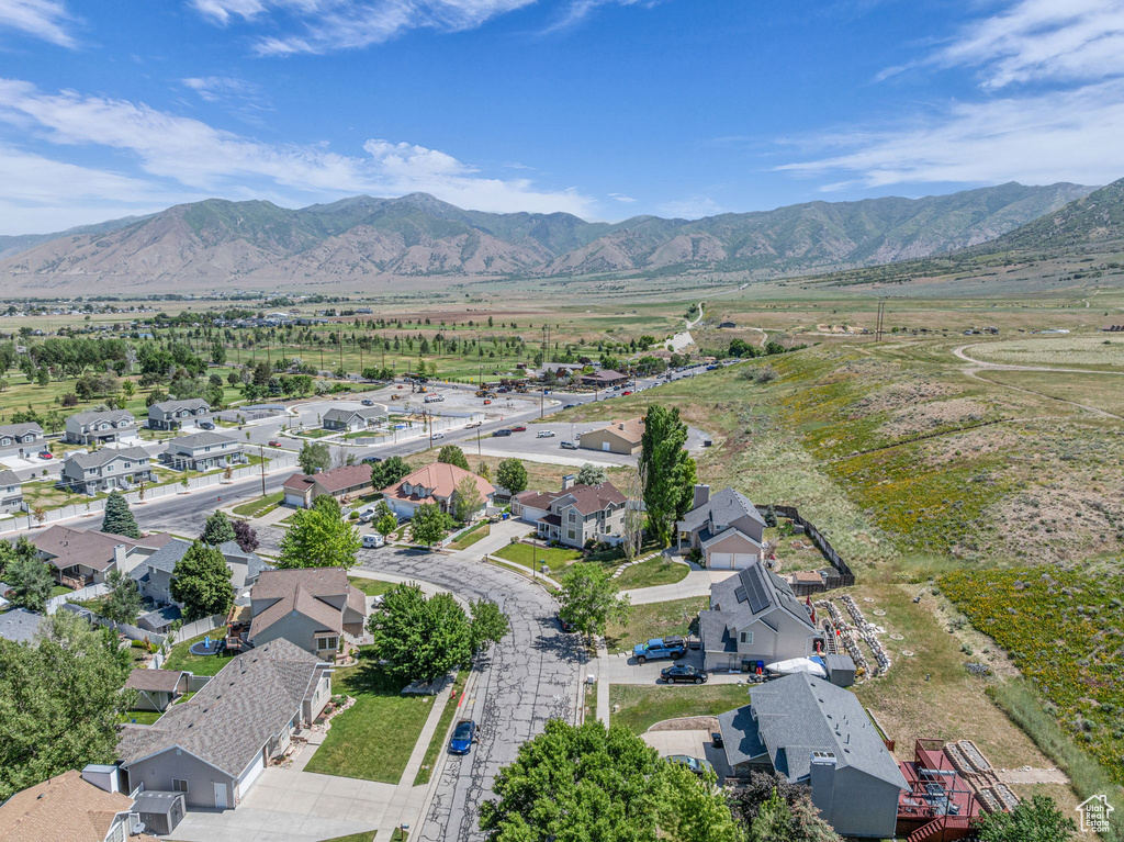 Aerial view of residential area featuring a mountainous background