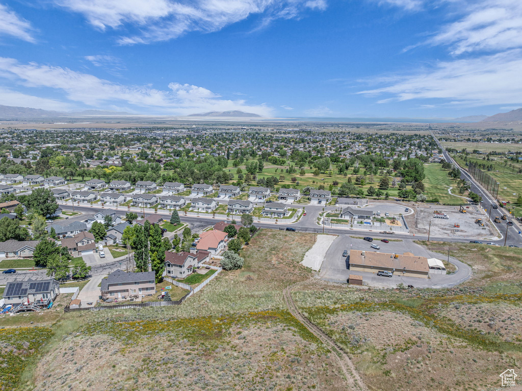 View of property location with a mountain backdrop and nearby suburban area