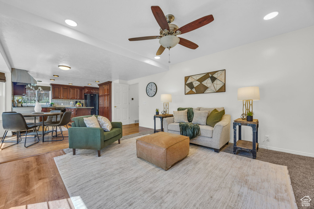 Living room featuring ceiling fan, recessed lighting, and baseboards