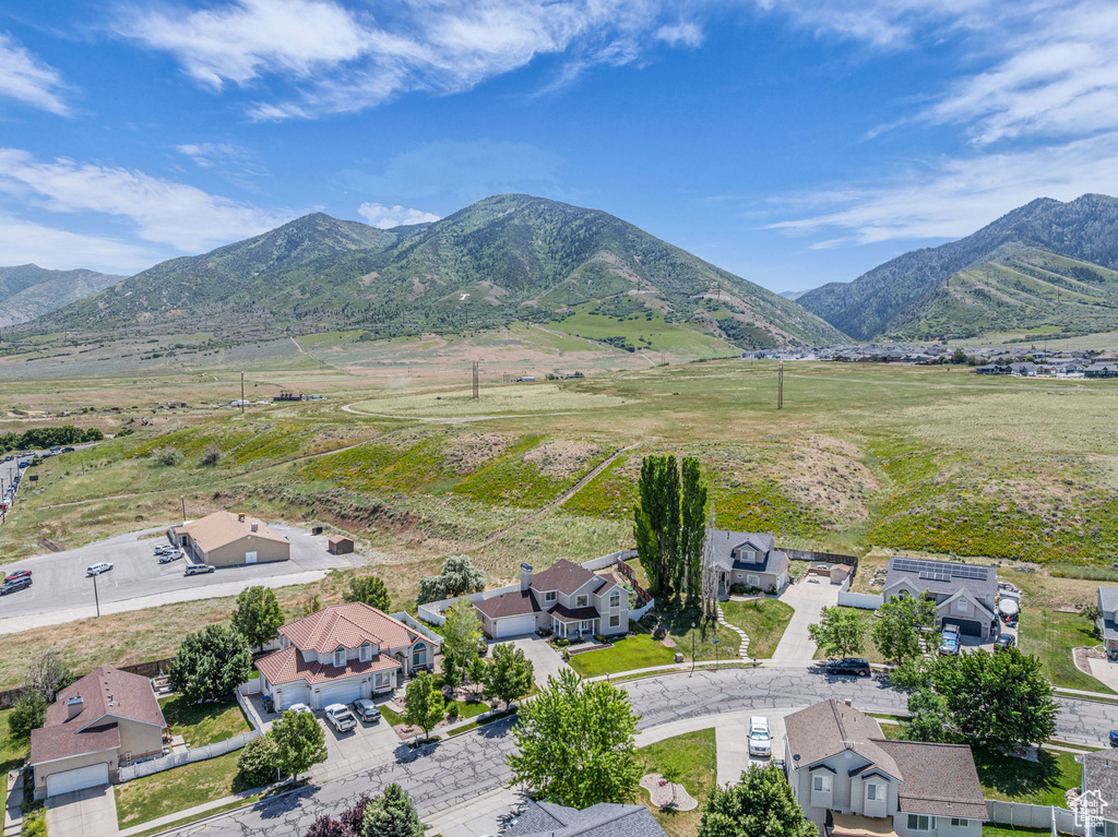 Overview of rural landscape with mountains and nearby suburban area