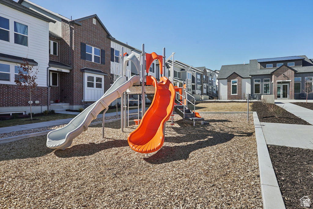 Community jungle gym featuring a residential view