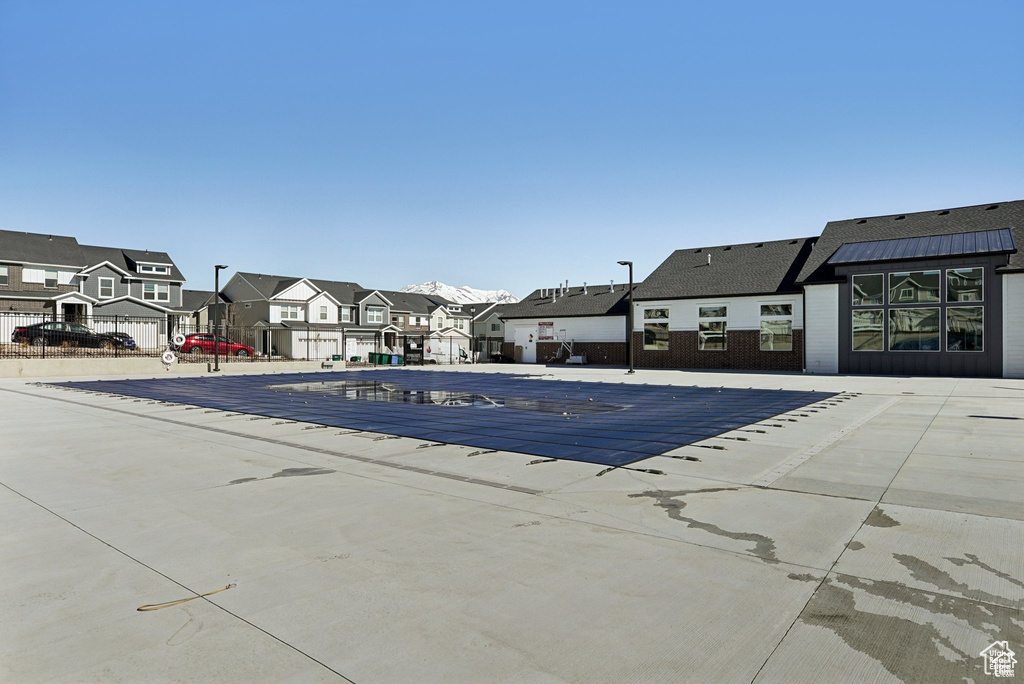 View of pool with a residential view
