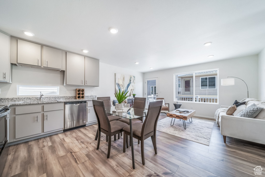 Dining space featuring light wood finished floors and recessed lighting