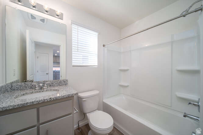 Full bathroom with vanity and shower / tub combination