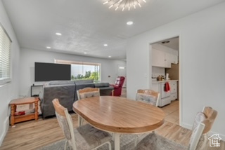Dining area featuring light wood-style flooring and recessed lighting