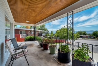 View of patio featuring a balcony