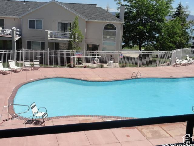 Community pool with a patio
