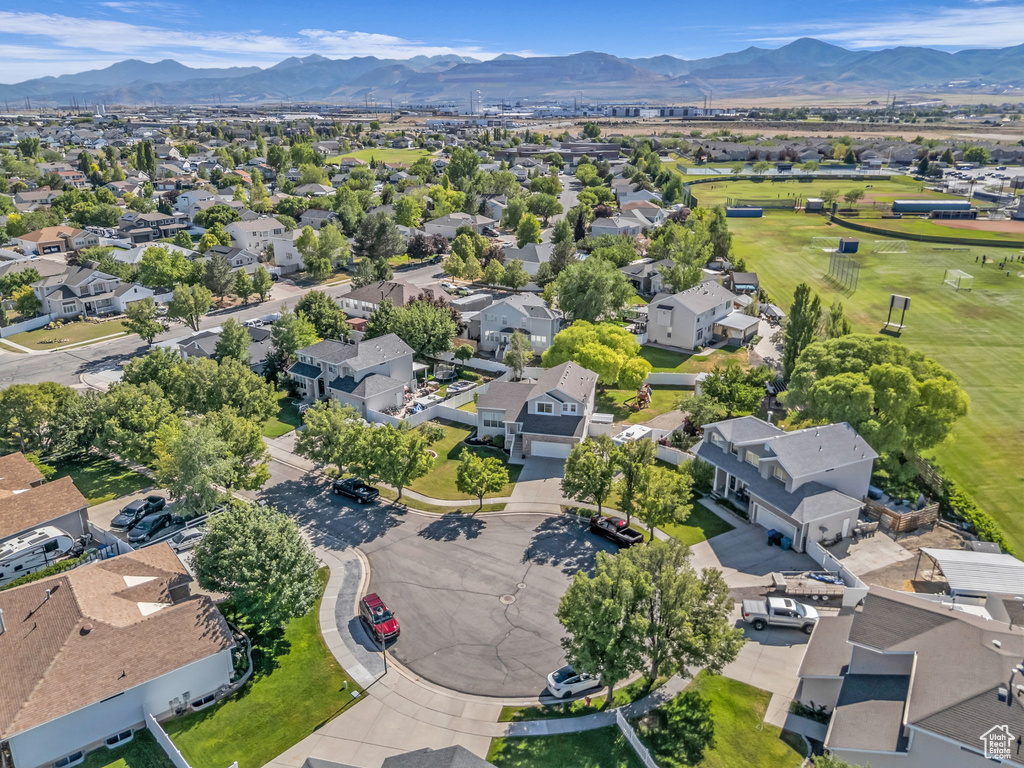 Aerial perspective of suburban area featuring a mountainous background