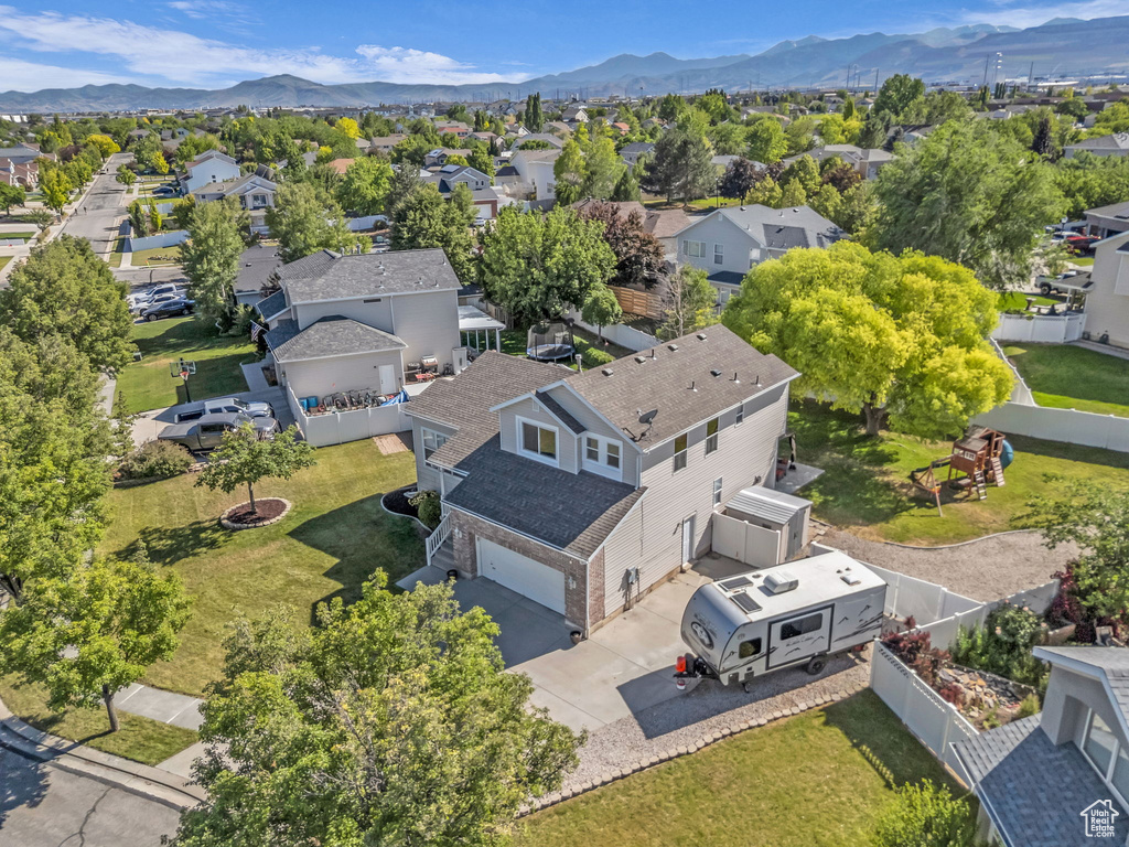 Aerial view of residential area featuring mountains