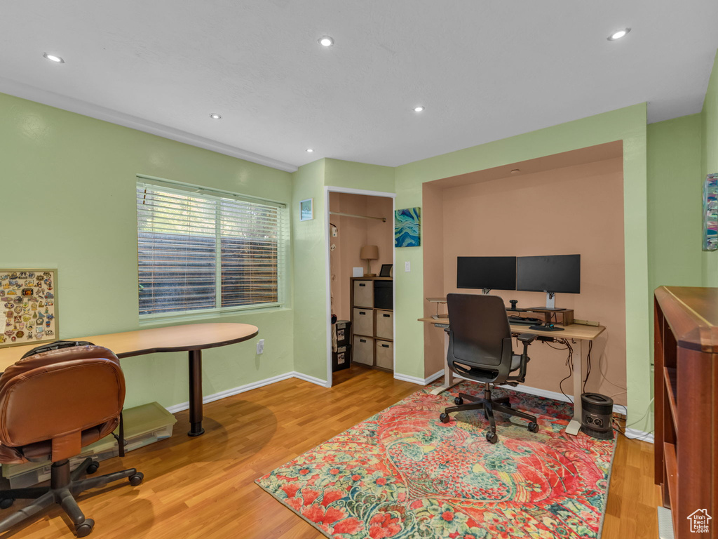 Office area with wood finished floors, recessed lighting, and baseboards