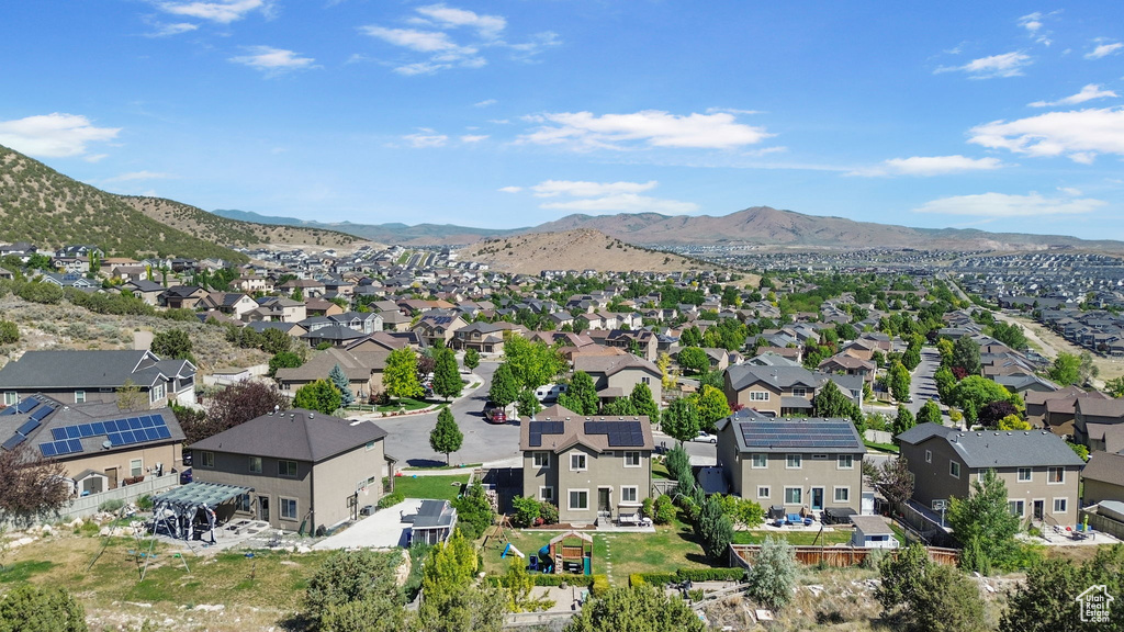 Aerial perspective of suburban area with a mountain backdrop