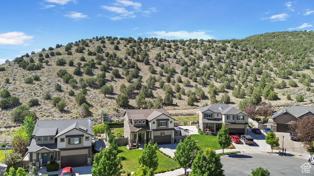 Aerial view of residential area featuring mountains