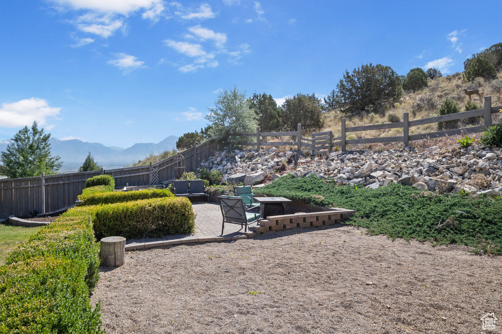 View of yard with a patio area and a mountain view