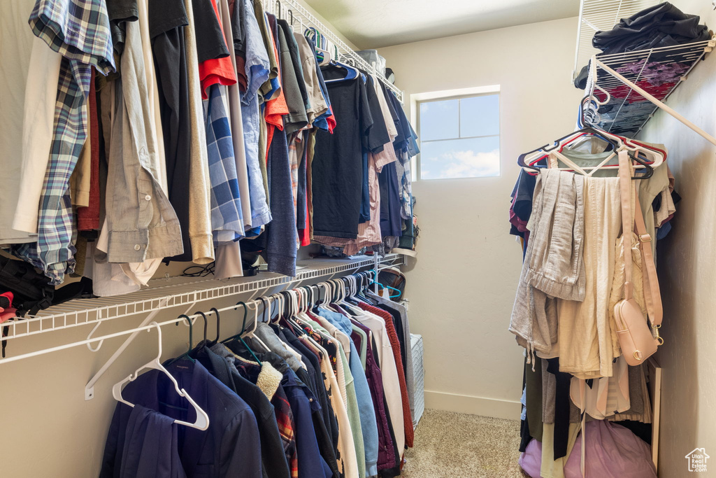 Spacious closet with carpet flooring