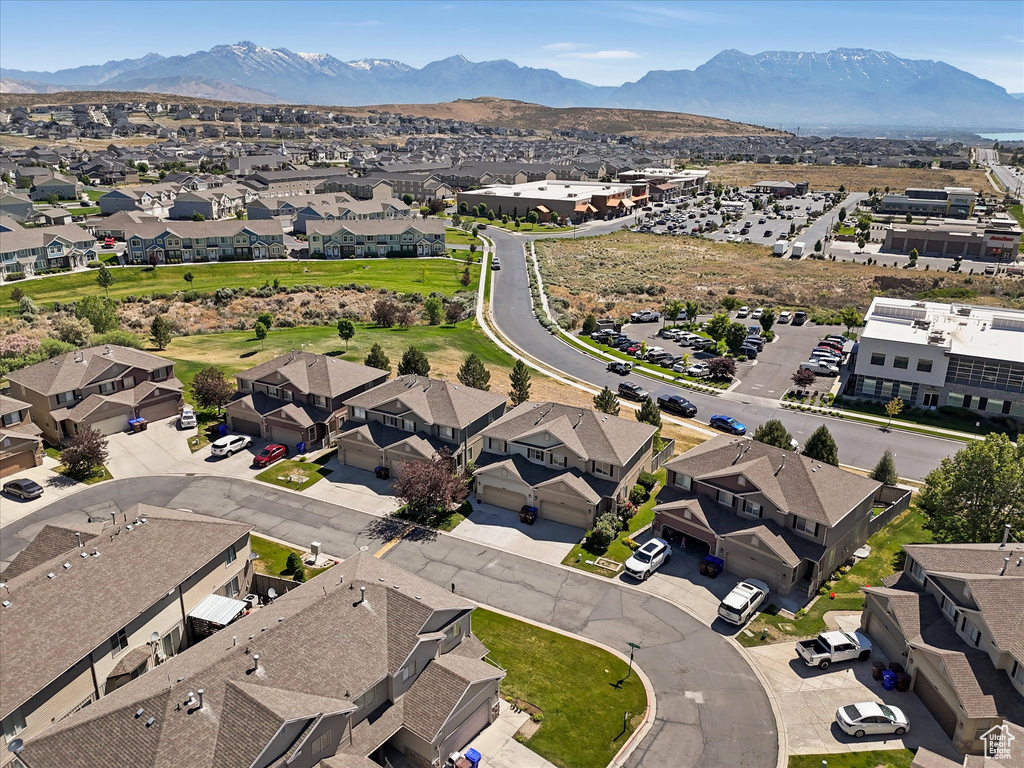 Aerial view of residential area featuring a mountain backdrop