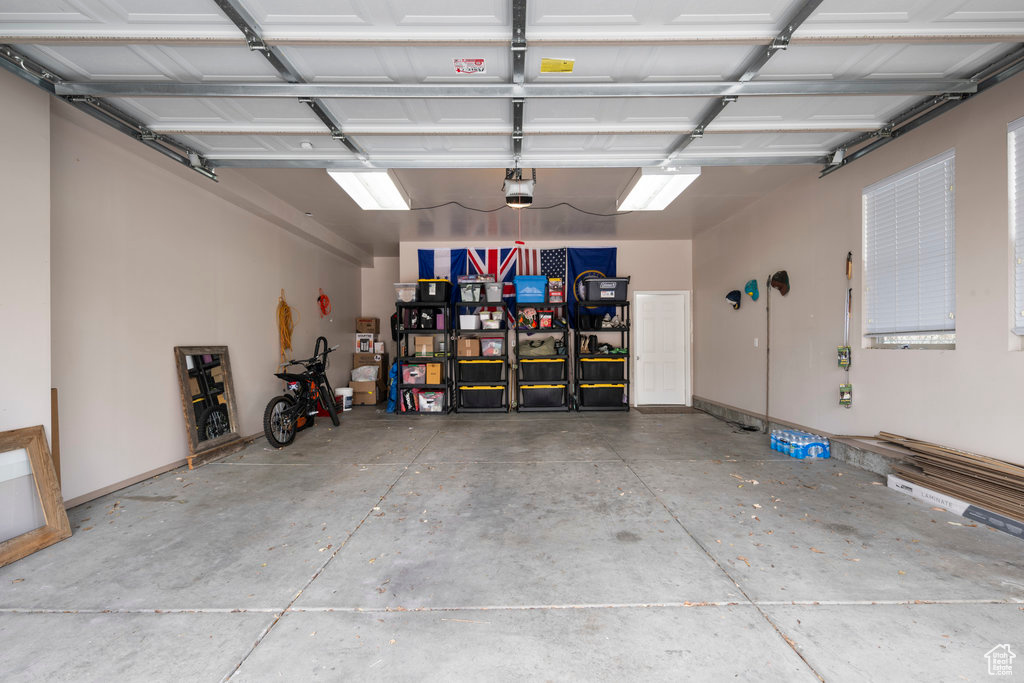 Garage featuring a garage door opener