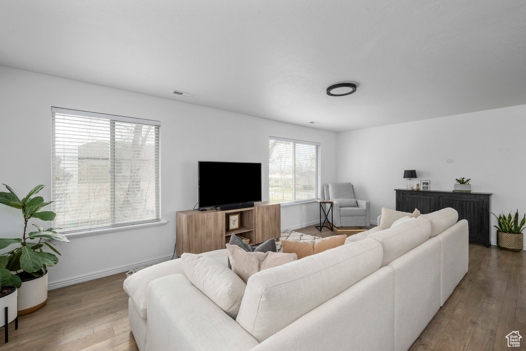 Living area featuring wood finished floors and baseboards