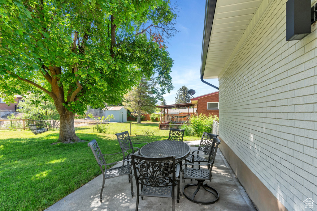 View of patio / terrace featuring outdoor dining area and a deck