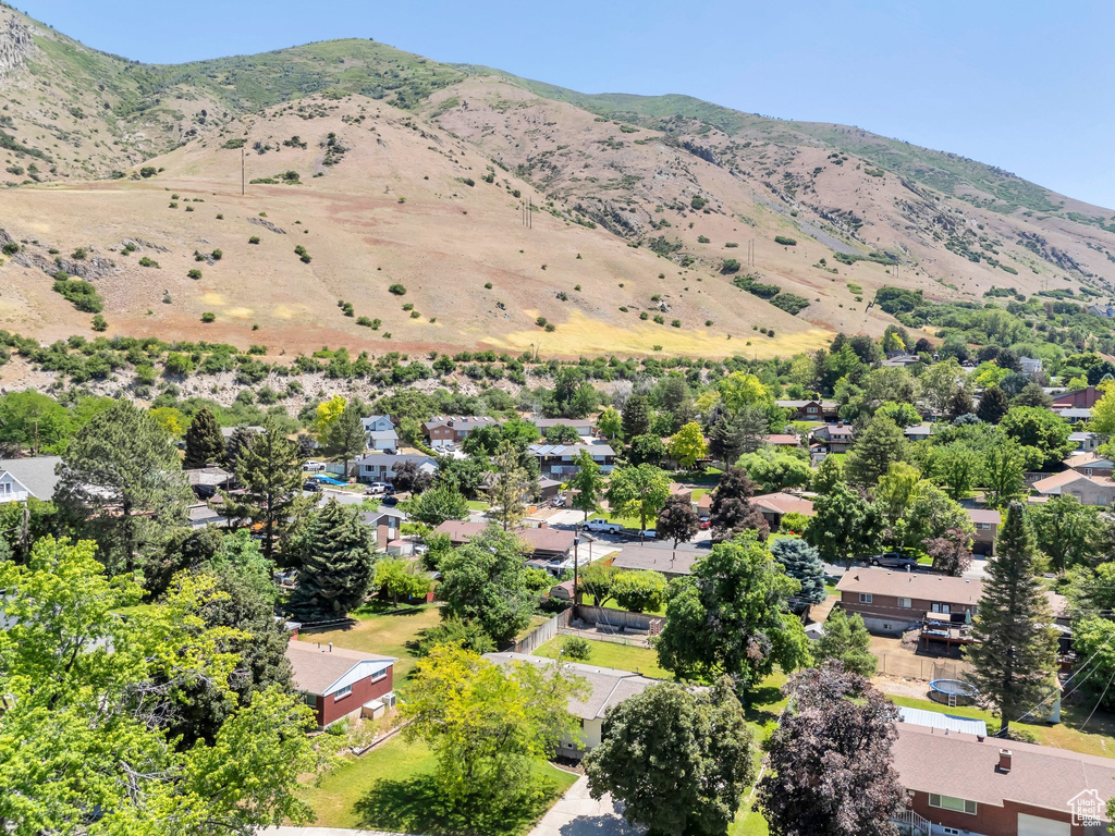 Aerial view of residential area featuring a mountainous background