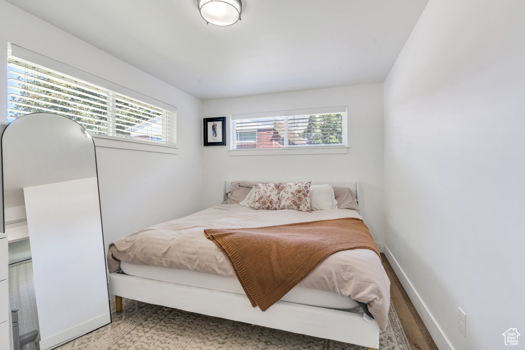 Bedroom with multiple windows and baseboards