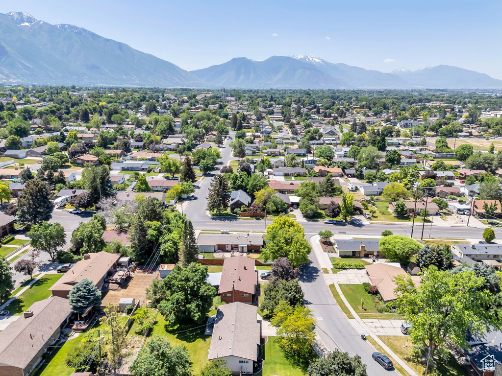 Aerial perspective of suburban area featuring a mountainous background