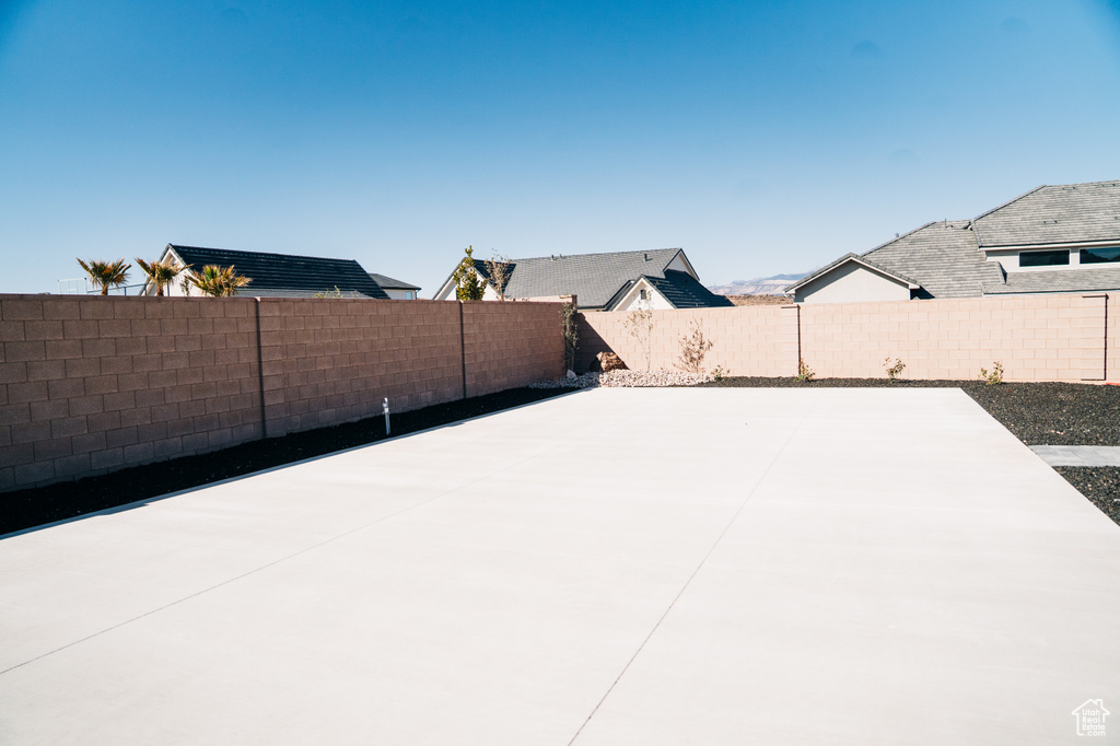 Fenced backyard with a patio area