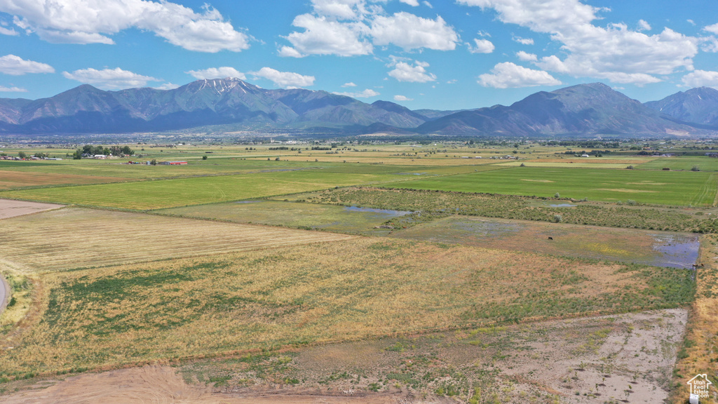 View of mountain backdrop with rural landscape