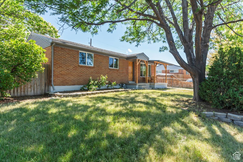 View of front of house featuring brick siding